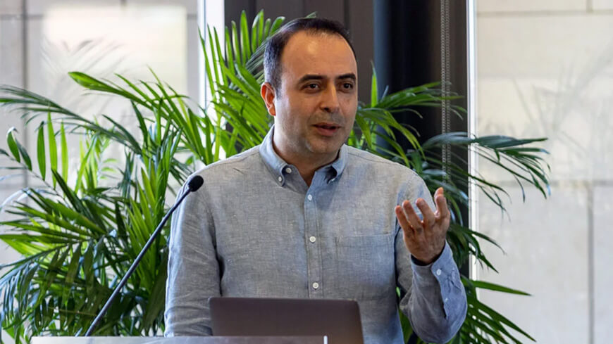 professor Amin Saberi speaks at the inauguration event for the center for computational market design